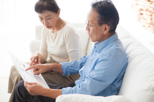 istock An elderly couple looking at the drawings. 903131990