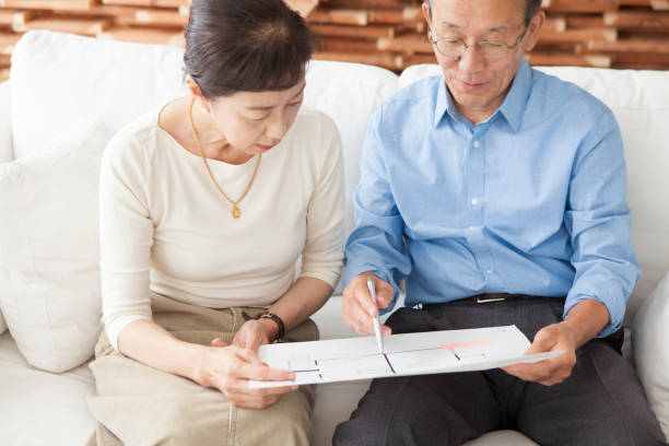 istock An elderly couple looking at the drawings. 903131992