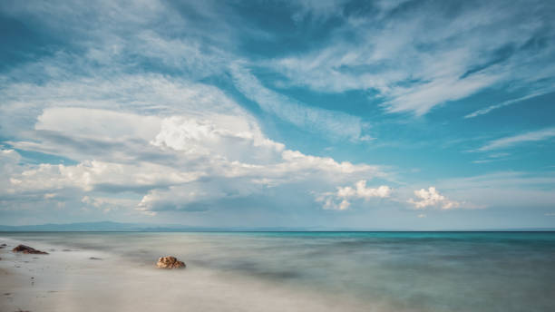 Beautiful cloudy seascape at sunset and blurred motion water.