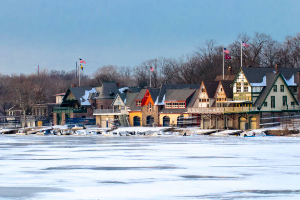 Philadelphia Boathouse Row Philadelphia Boathouse Row in Winter over Frozen River philadelphia winter stock pictures, royalty-free photos & images