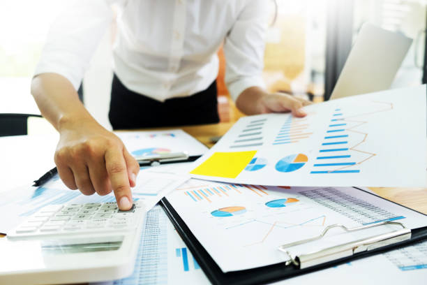 istock Midsection Of Woman Working At Desk In Office 903150828