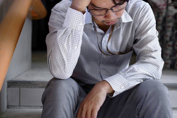 istock Close up depressed young Asian business man suffering from severe depression. 903153670
