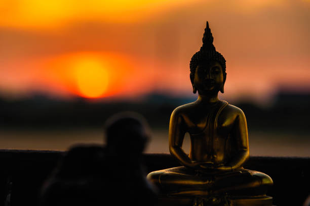 istock Silhouette buddha statues on blurred sunset background.Thailand. 903158098