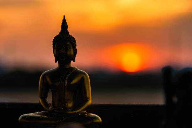 istock Silhouette buddha statues on blurred sunset background.Thailand. 903158138