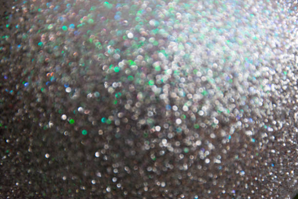 istock Abstract blurred bokeh of siver grey twinkled glitter use for christmas background. 903160632