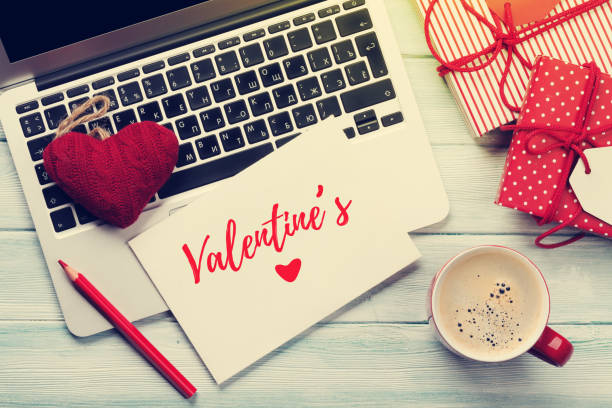 istock Working on laptop and wrapping gifts 903169044