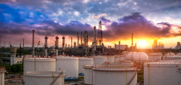 Oil and gas industry - refinery factory - petrochemical plant at sunset Oil and gas industry - refinery factory - petrochemical plant at sunset greenpeace stock pictures, royalty-free photos & images