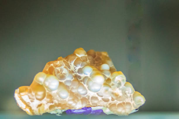 istock Chalcedony quarts part of geode specimen from mining. Chalcedony is transparent or opaque and can be found as geodes and small masses. The colors of chalcedony are white, pink, blue, red or gray. 903176546