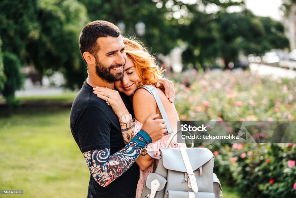 Cute couple in summer park Cute couple of young people in summer park Couple - Relationship Stock Photo