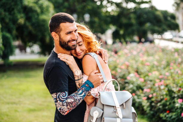 Cute couple in summer park stock photo