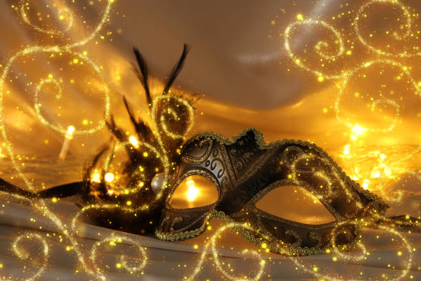 istock Image of elegant venetian mask over gold silk background. 903179210