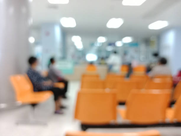 istock Blurry image of chairs for people waiting in hospital. 903182664