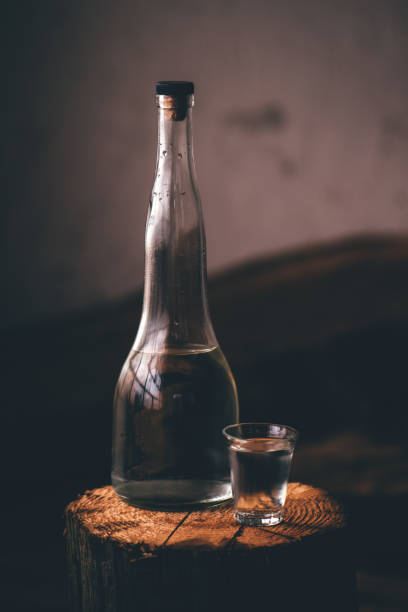istock Strong alcohol drink in bottle with shot glass 903183790
