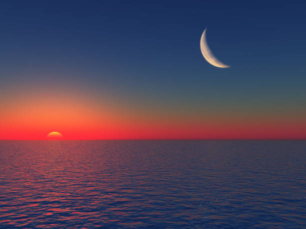 istock Sunrise over Sea with Moon 903184202
