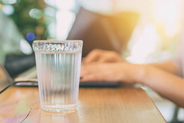 istock drinking or sip water while working in office better for health 903186332