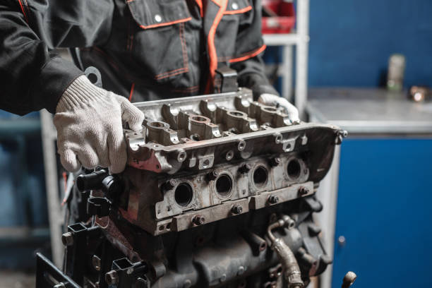 istock The mechanic disassemble block engine vehicle. Engine on a repair stand with piston and connecting rod of automotive technology. Interior of a car repair shop. 903186736