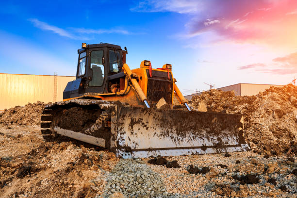 istock bulldozer at construction site and sunrise landscape 903191342