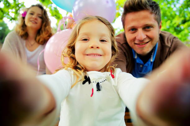 istock Young beautiful family taking selfie 903195768