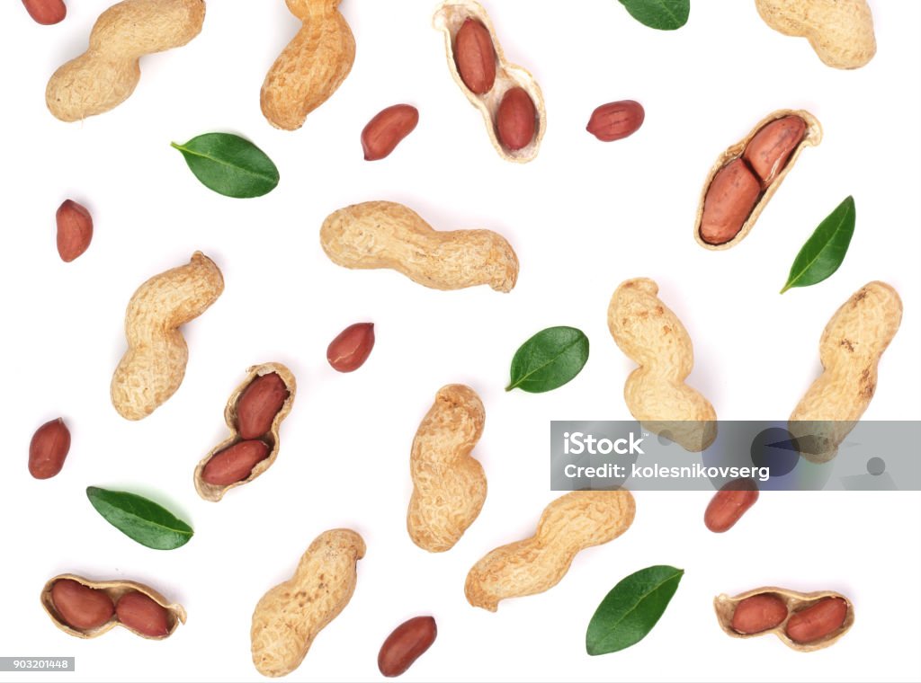 Peanuts with shells isolated on white background with copy space for your text, top view. Flat lay pattern Peanuts with shells isolated on white background with copy space for your text, top view. Flat lay pattern. Building Exterior Stock Photo
