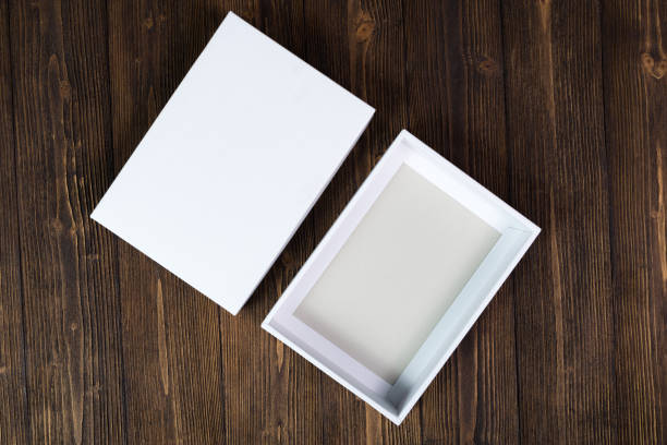 istock Empty white gift box or tray for mock up on dark wooden table with copy space. 903201842
