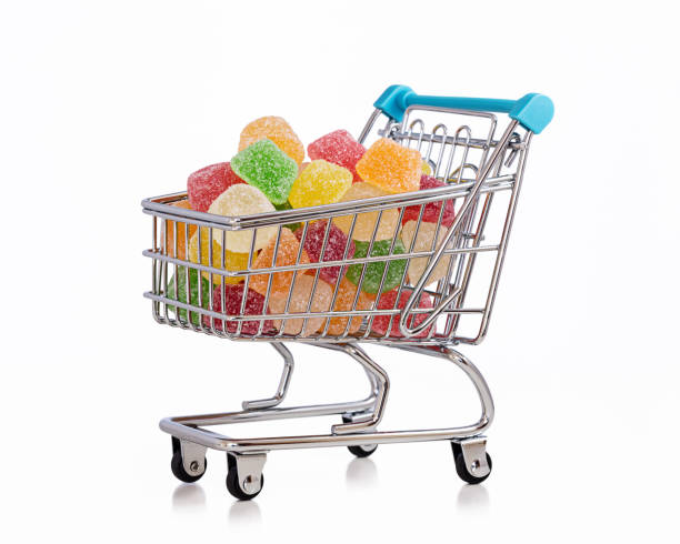 istock Multicolored sweets in shopping trolley. 903203014