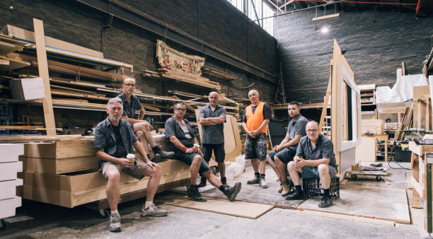 Group Picture Group picture of factory workers carpenter portrait stock pictures, royalty-free photos & images