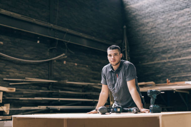 Worker Portrait Confident young professional looking at camera carpenter portrait stock pictures, royalty-free photos & images