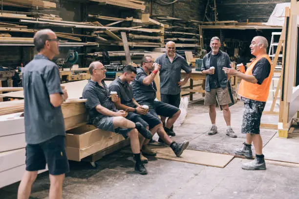 Factory workers having a coffee break