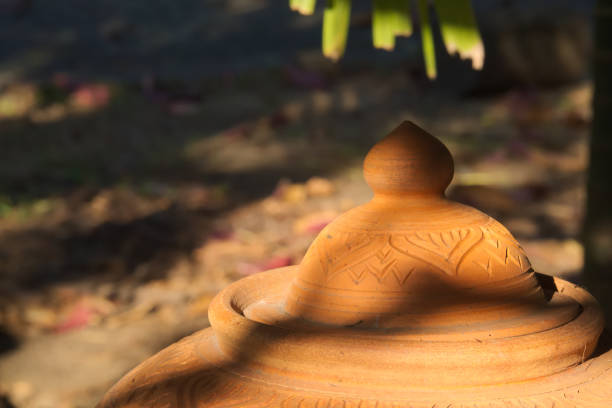 istock Thai clay water vessel; customary, front-of-home welcoming water source for visiting guests in Thailand. 903212764