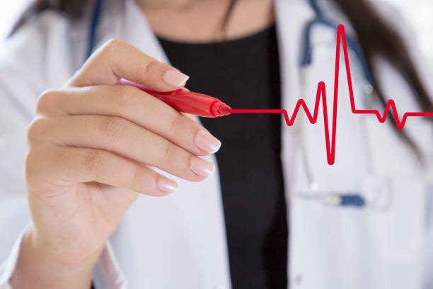 istock Doctor drawing ecg heartbeat chart 903214364