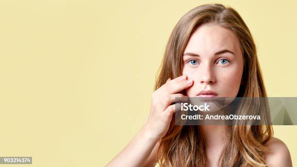 Young Redhead Teenager With Self Issues Looking Into Mirror Girl With Low Self Esteem Checking Her Skin In A Mirror Stock Photo - Download Image Now