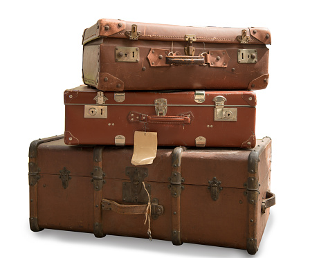 three old suitcases isolated on a white background