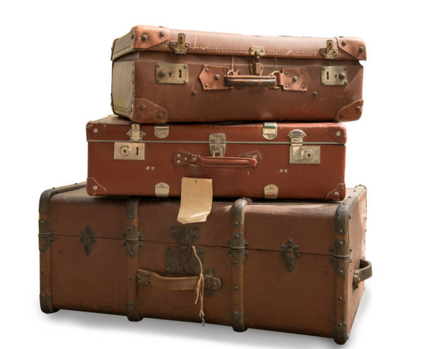 three old suitcases isolated on a white background - pilha roupa velha imagens e fotografias de stock