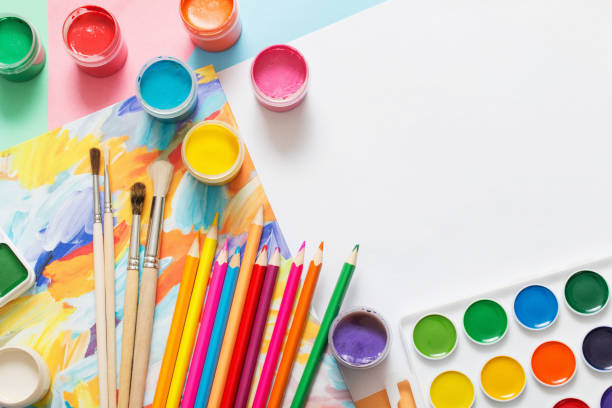 istock paints, pencils and brushes on paper 903221446