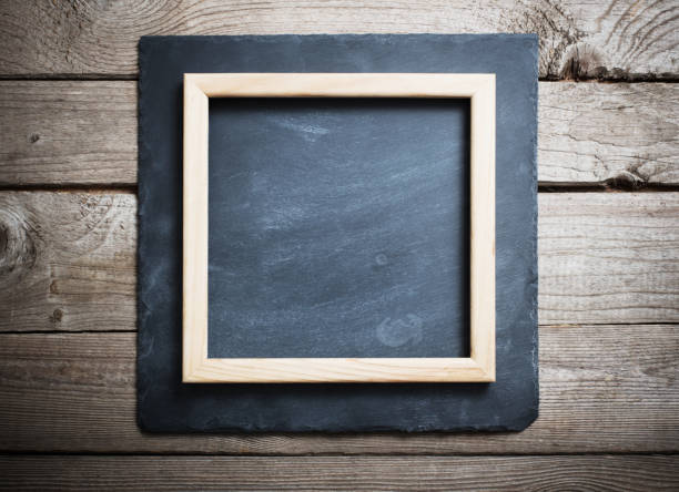 istock old wooden background with black stone board 903221448