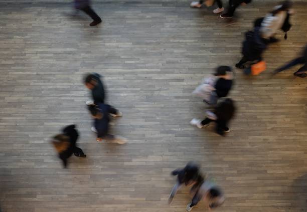 istock Blurry people walk in the mall 903224348