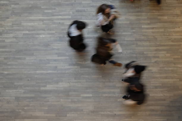 istock Blurry people walk in the mall 903224488