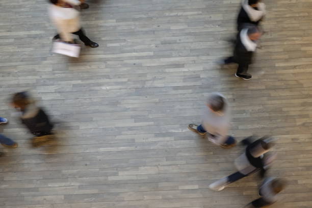 istock Blurry people walk in the mall 903224594