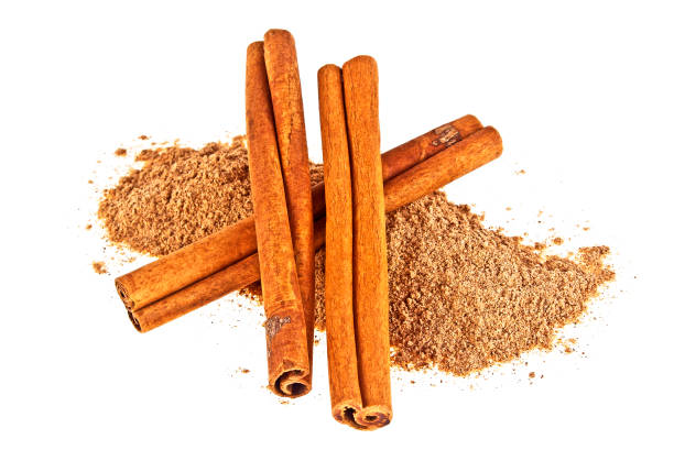 istock Cinnamon sticks with powder isolated on white background 903225206