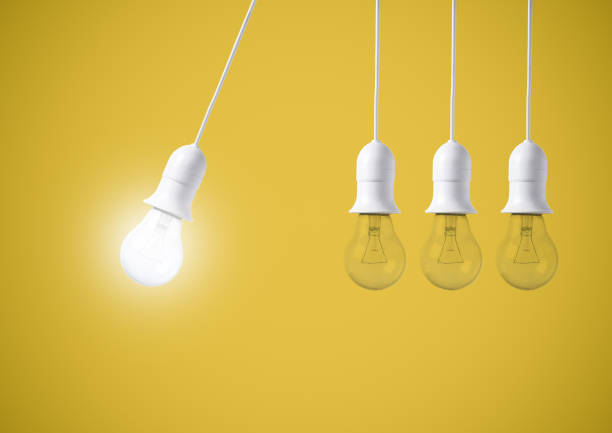 istock difference light bulb on yellow background. concept of new ideas with innovation and creativity. 903225778