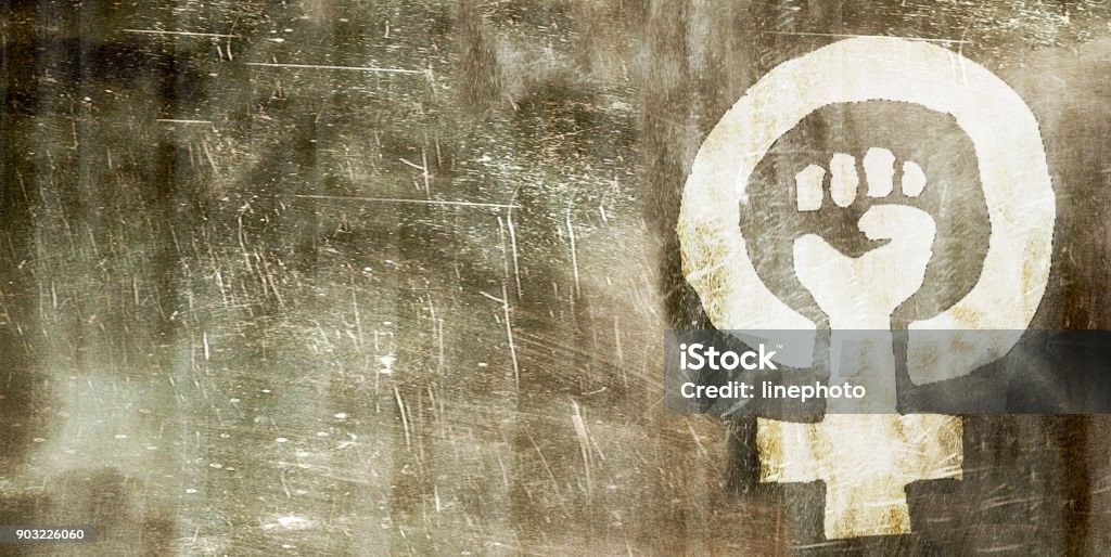Woman Signs graffiti on the wall in town Girl Power Stock Photo