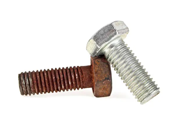 Photo of Two bolts on white background, new and rusty