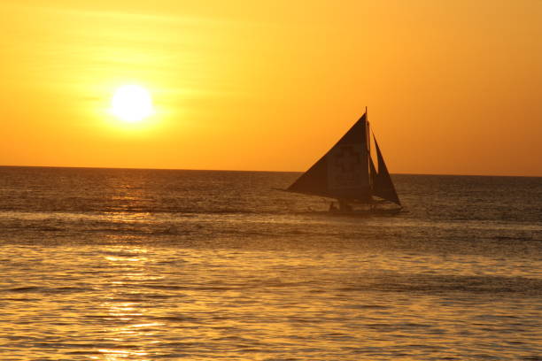 istock Boat at sunset off White Beach, Boracay, Philipinnes 903229708