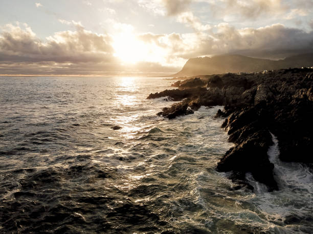 istock Late afternoon sun set over the ocean 903230142