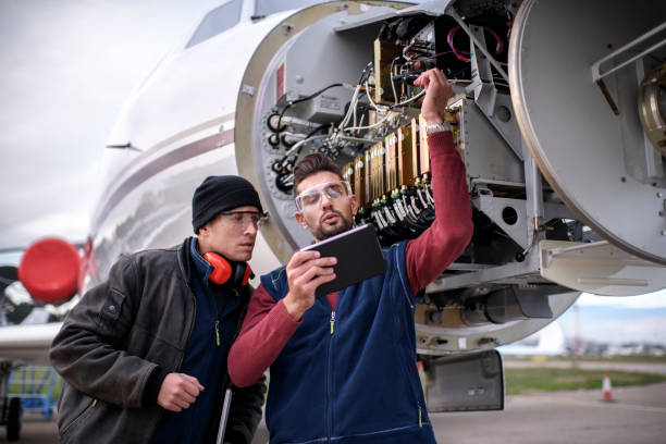 istock Aircraft mechanics in the hangar 903231430