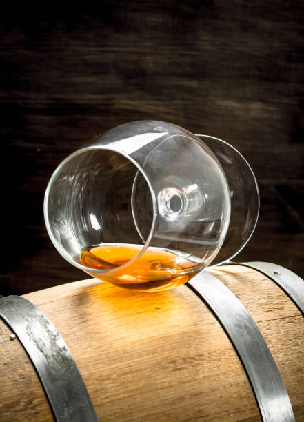 istock barrel with a glass of cognac. 903232794