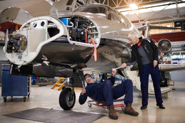 istock Aircraft mechanics in the hangar 903232922