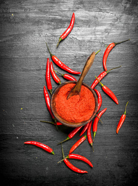 istock Ground hot peppers in a wooden bowl. 903237904