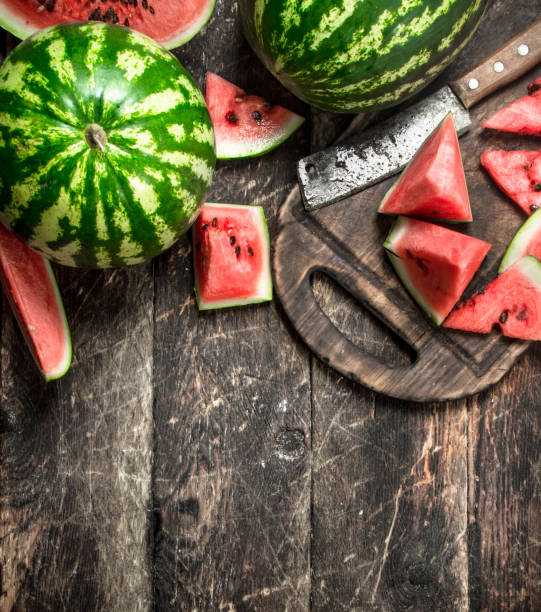 istock Sliced slices of ripe watermelon on a board. 903242504