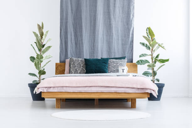 istock Wooden bed in bedroom interior 903245638